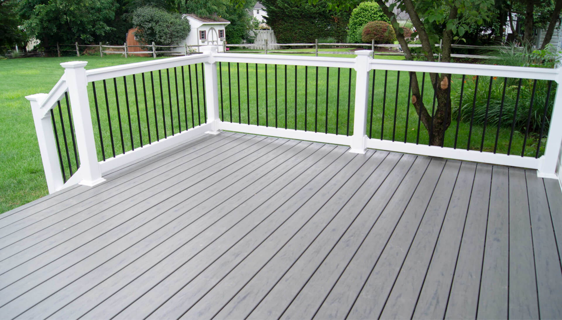 Grace your front lawn with a fresh deck with railings in Green Bay, WI